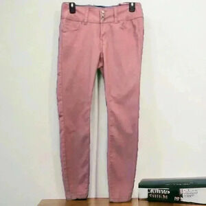 Wax Jean Junior’s size 7 pink skinny jeans. Three-button front. Tapered Ankle.